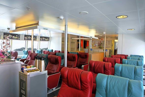 Relax at the Emerald Class spacious seating area and have a complimentary drink on the flight.