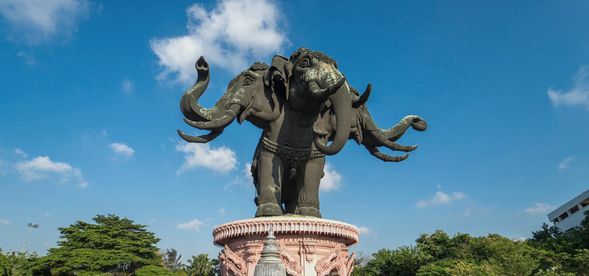 The Erawan Museum is a themed museum located in Samut Prakan, a suburb of Bangkok, Thailand. It is marked by a giant three-headed Ganesha statue, which is as tall as a 10-story building. The interior is divided into three major areas: Heaven, Earth, and Hell. The intricate carvings, stained glass, furniture, antique pottery, and artwork showcase the essence of ancient Thai art and crafts. The interior, with its predominantly pink and white colors, has become a popular photo spot for tourists.