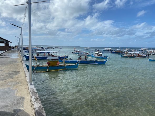 Head to General Luna port and boat dock (2-minute walk)