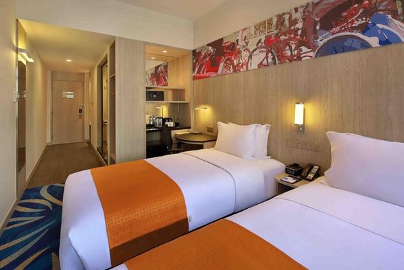 Check in Hotel Royal or Holiday Inn Express or Similar