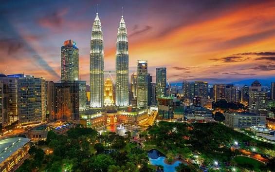 KLCC (Kuala Lumpur City Centre), home to the world-famous Petronas Twin Towers. Once the tallest buildings in the world, these iconic towers symbolize Malaysia's modern development and are surrounded by shopping, restaurants, and the beautiful KLCC Park.
