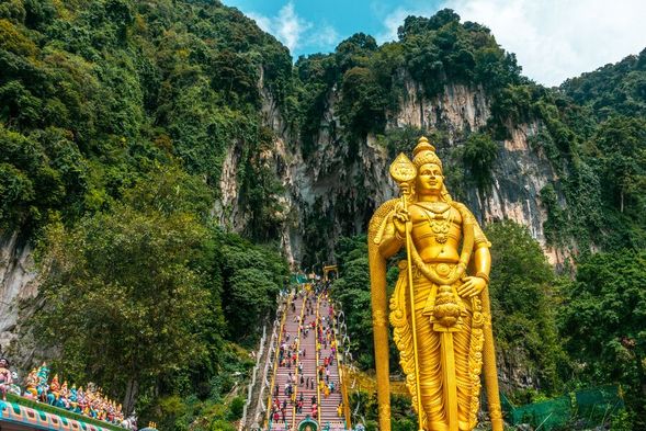 Batu Caves
Conclude your tour at Batu Caves, one of Malaysia's most significant Hindu pilgrimage sites. Climb the colourful 272 steps to explore the limestone caves, admire the magnificent Lord Murugan statue, and enjoy spectacular views from the top.