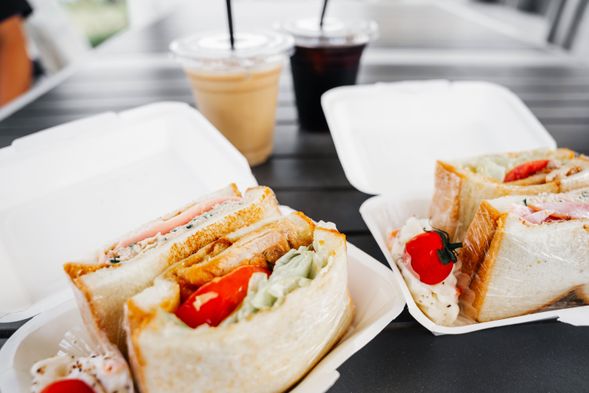 Have a enjoy your breakfast, such as sandwiches, while looking out at the sea.