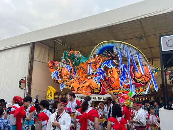 Watching the Nebuta Festival from the reserved seats.