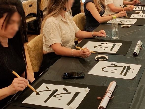 Calligraphy Experience: Create a mini hanging scroll under the guidance of a Monk.