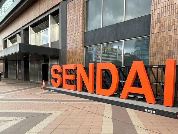 Meet at Sendai Station, in front of big "SENDAI" signboard.