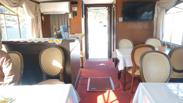 Relax comfortably on board with chairs and tables provided.