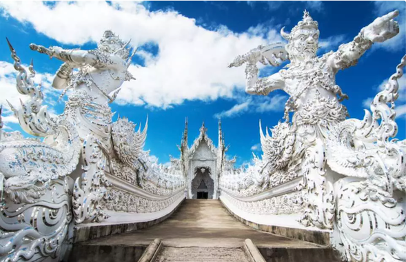 Take a closer look at the fine carvings at the entrance of the temple.