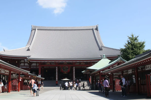 Asakusa Temple: Asakusa Temple is located in Taito ku, Tokyo, Japan. It was first built in the 36th year of Emperor Tsuchigu's reign (628 AD) and is said to have been built after fishermen salvaged a statue of Guanyin from the Sumida River. It is the oldest surviving Buddhist temple in Tokyo. The main building of the temple is in Edo style, including the Wind and Thunder God Gate, the Gojo Pagoda (the second tallest Buddhist pagoda in Japan), the main hall, and other major buildings. The Thunder Gate was first built in 942 AD and was rebuilt in 1960 after a fire. Its giant lanterns hanging from the gate and 140 meters of stone paving inside the gate together form a landmark landscape in Tokyo.